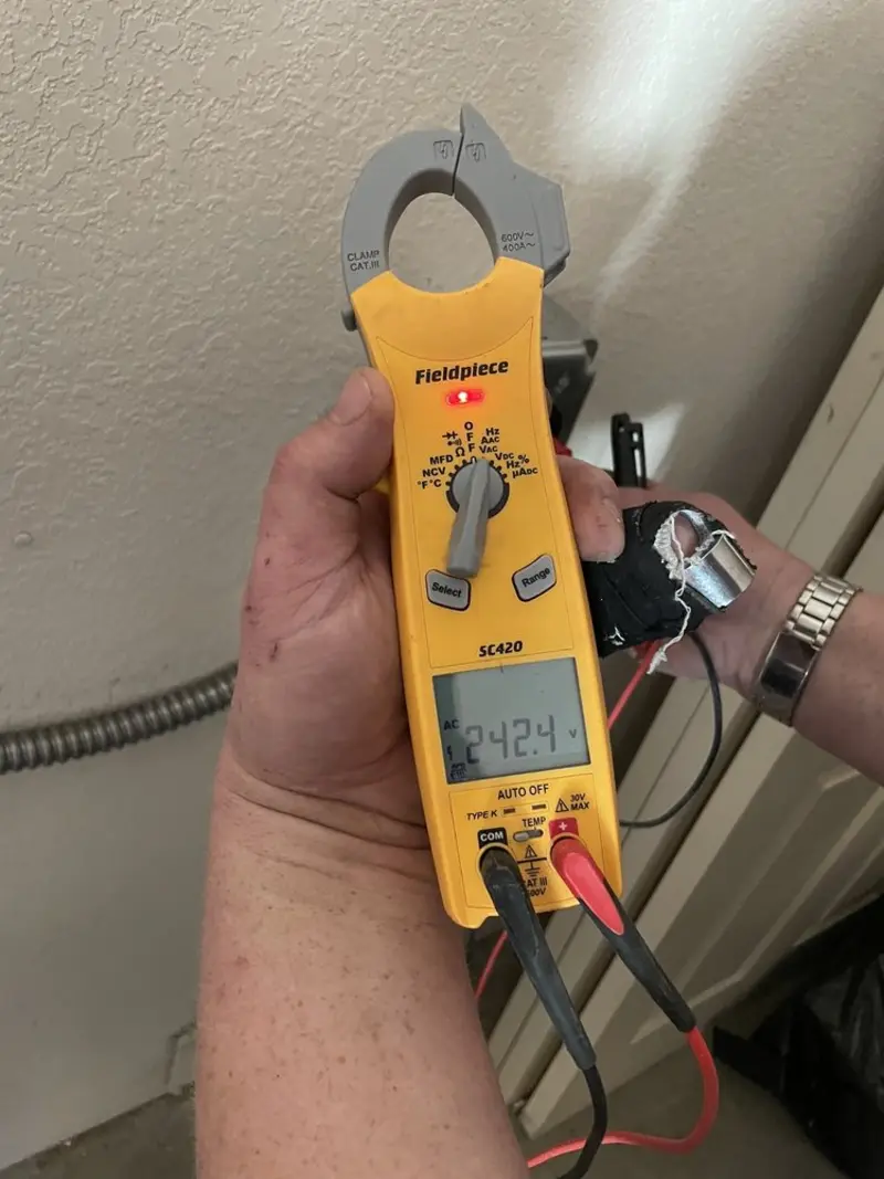 Voltage testing with clamp meter during Outlet Installation in Gardiner